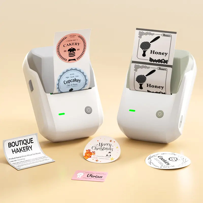 Two compact thermal printers dispensing sample labels with black text and graphics