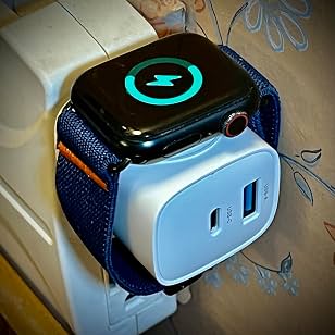 Compact charging block with a watch attached in a small setup