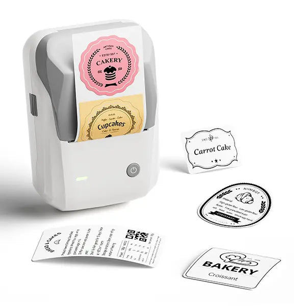 Compact grey B1 thermal label printer with a front power button, label exit and sample bakery labels